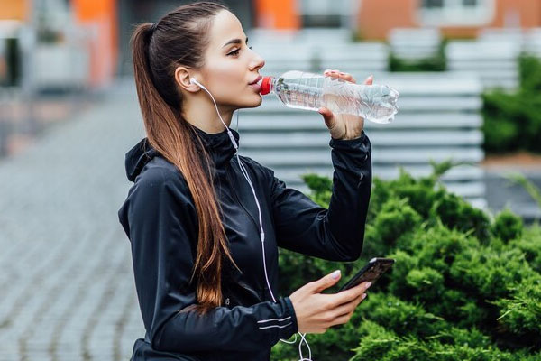 water drinking girl mobile headphones